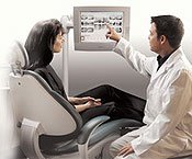 Doctor talking to a patient about their Gendex digital radiographs